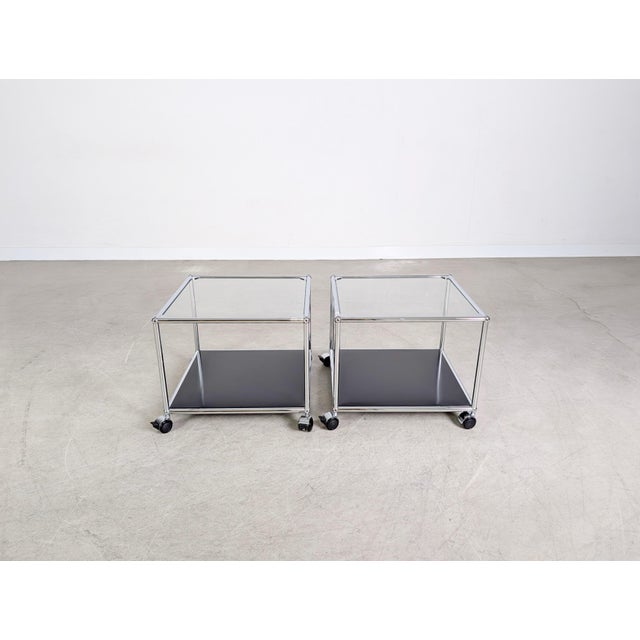 One of two beautiful coffee/side tables from the renowned swiss manufacturer usm haller. The tables feature a metal lower...