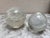 Set of two solid glass ball bubble paperweights- one smaller and one larger. Effervescent clear glass design. Smaller one...