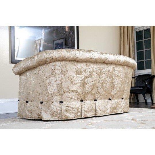 This elegant classic sofa features a gracefully rolled back and arms, complemented by a tailored pleated skirt that adds...