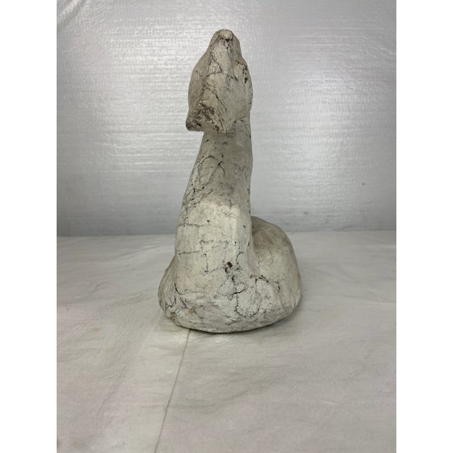 Single folk art style sculpture of waterfowl or duck. Hand made of paper mache with chippy white painted finish and some...