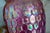 Striking handblown studio art glass vase by Josh Ries, featuring a luminous iridescent pink finish with an intricate...