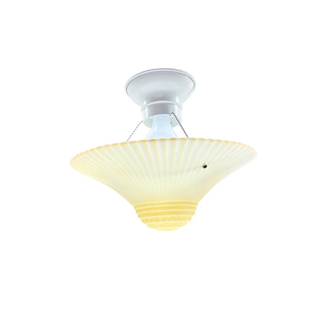 These hanging bowl lights where the glass is supported by three short bead chains were hugely popular for decades from the...