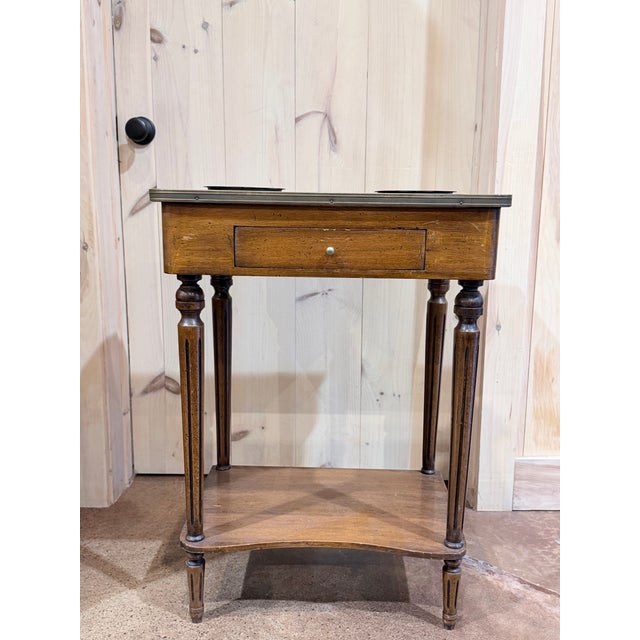 An elegant Louis XVI style rafraichissoir crafted in richly toned mahogany with refined neoclassical proportions and...