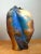 With its sculptural asymmetry and dynamic drip glaze, this vintage ceramic vase brings a strong Mid-Century Modern accent...
