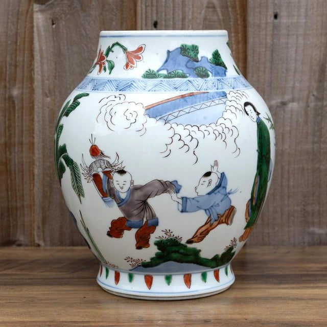 A highly decorative Chinese porcelain vase featuring vibrant famille verte and wucai decoration, combining traditional...