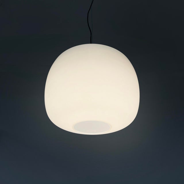 Italian chandelier in opaline glass, brass and black metal, 1950s Chandelier with rounded diffuser in opaline glass. In...