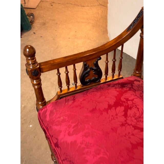 Design Plus Gallery presents an Antique Victorian Settee. The settee has turned wood posts with rounded finials, curved...