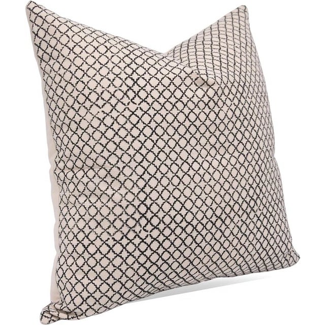 The Kabutar Jaal cushion cover features a captivating hand block printed design inspired by traditional lattice patterns...