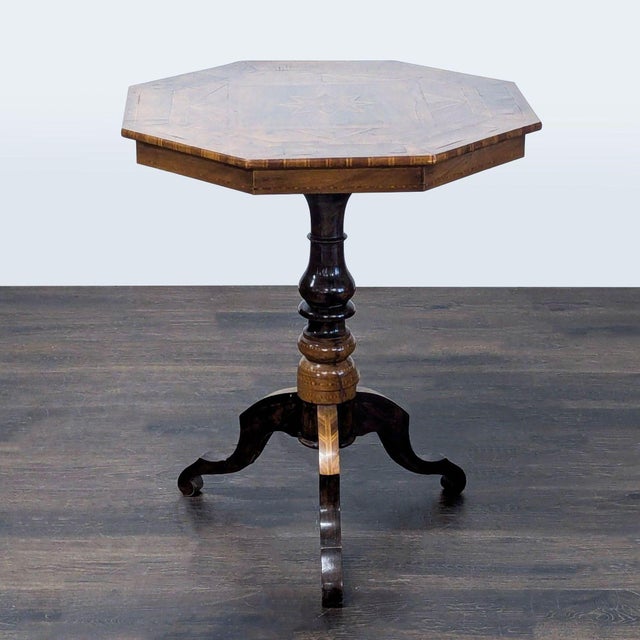 Inlaid top with center star medallion on a pedestal base. Dimensions (in): 28W x 26D x 30H.