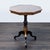 Inlaid top with center star medallion on a pedestal base. Dimensions (in): 28W x 26D x 30H.