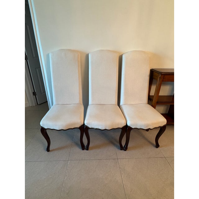 Elevate your dining space with this set of six Palecek White High Back Dining Chairs, where modern sophistication meets...