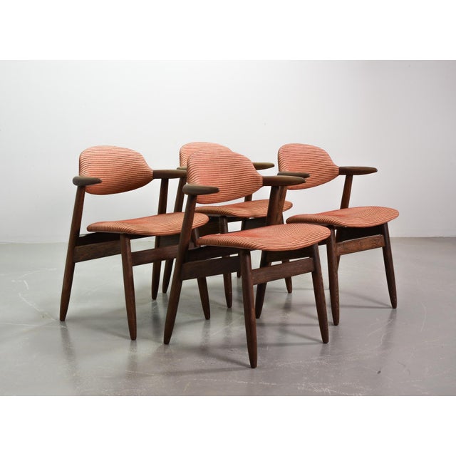 Set of four authentic elegantly crafted mid-century vintage ‘Cowhorn’ dining chairs from the Propos series, designed by...