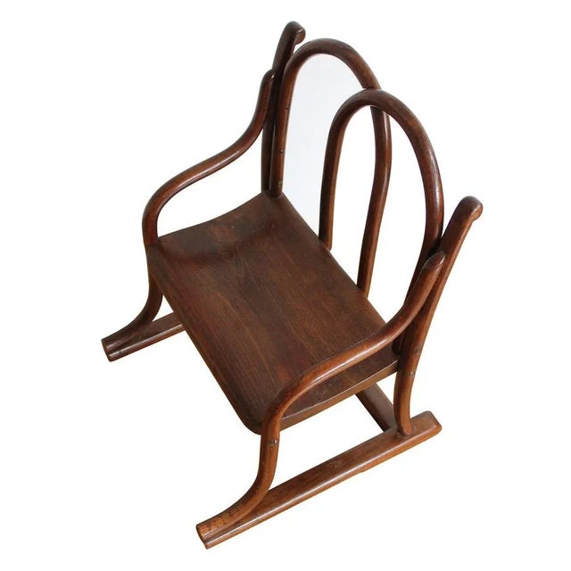 An authentic bentwood kids chair made at the beginning of the 20th century. Originally this chair was connected to a small...
