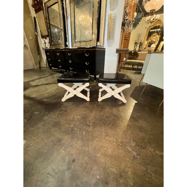 This product is a pair of French carved and painted X form benches, adding a touch of elegance and charm to any home. The...