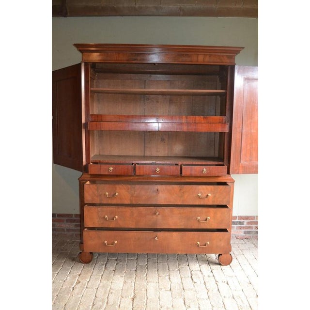 19th-century English mahogany cabinet. It is 214 cm high, 155 cm wide, and 56 cm deep. Behind the doors are shelves and...