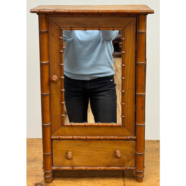 Antique French faux bamboo detail hanging cabinet circa 1880. It is most likely made of fir wood with a natural finish....