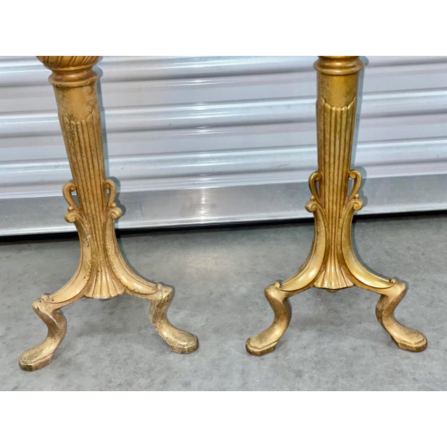 Solid heavy textured brass candle stands with beaded border and leaf detail. Tripod Art Deco legs. One stand is missing...