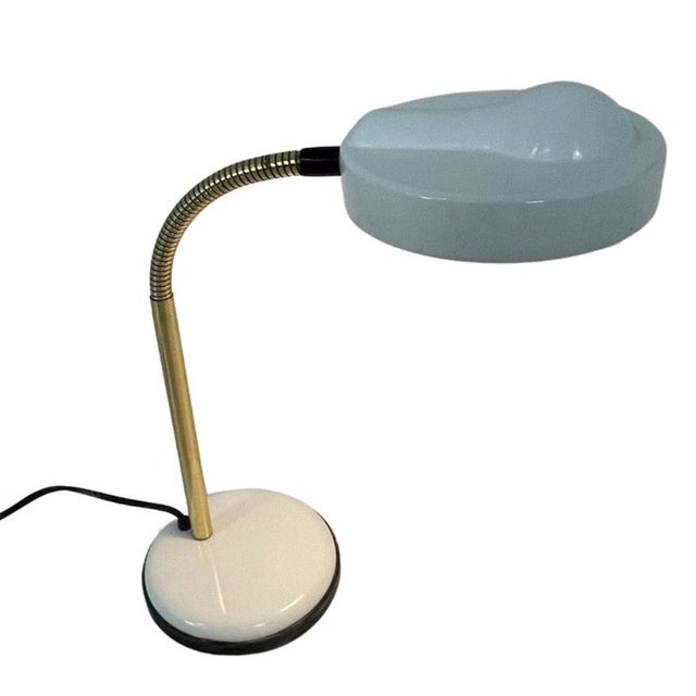 Uniquely shaped desk lamp made by ‘Mayja’ and marked as such on the bottom of the foot. A playful design with a pressed...