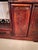 Antique chinese hardwood display cabinet having a pierced gallery top above stepped shelves and supported by turned...