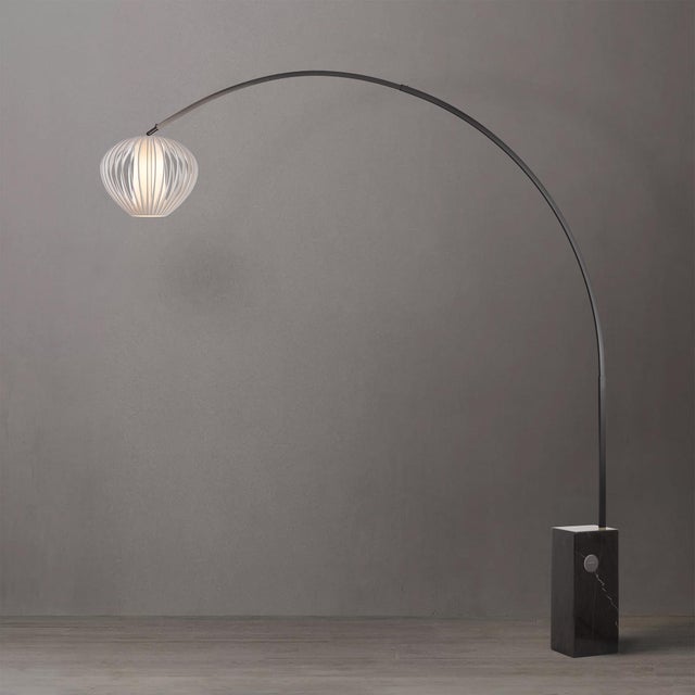 The Iconic Arc Lamp is a sophisticated lighting solution with a Black Nickel steel frame and a Sphere White Satin steel...
