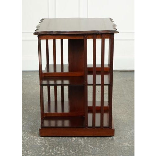 Edwardian Revolving Bookcase. The Antique Edwardian Revolving Bookcase with a Serpentine Shaped Top is a true gem from the...