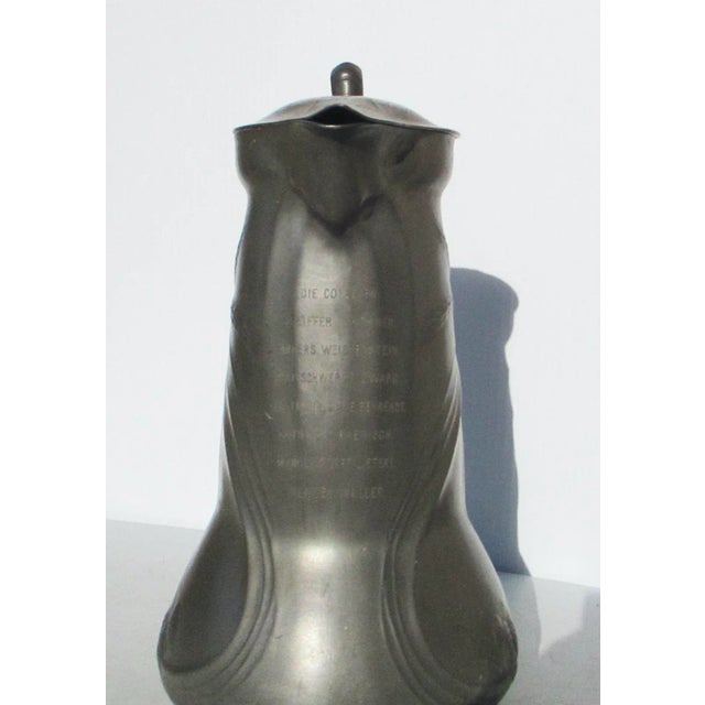 Kayserzinn Lidded pewter pitcher. High style art nouveau body with graceful swirls and sculptural handle. Marked...