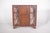 Rosewood display case. The piece has straight, well-defined shapes, with geometric details that add beauty and elegance to...