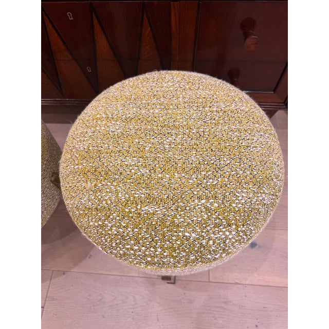 A charming pair of Italian 1960s ottomans/poufs standing on 4 gilded bronze with patina legs newly upholstered in...