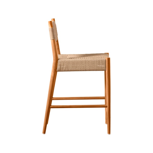 Experience the sophistication of the Alma Indoor/Outdoor Counter Stool, made with a slim, tapered teak frame and an...