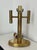 A sweet petite 1970s brass cylinder lamp with a dual arm candelabra design. Perfect for small bedside table, or bath. In...