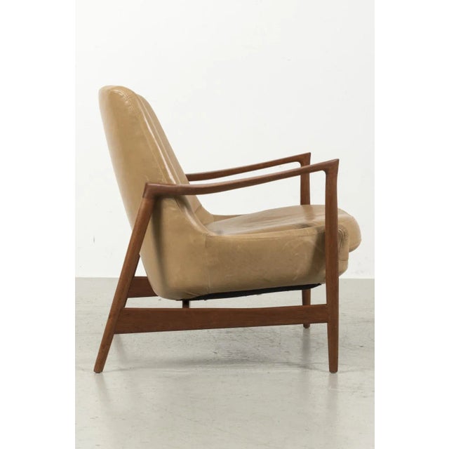 Wonderful model "4346" armchair designed by lb kofod-larsen for fritz hansen in 1956. The chair has a beautiful wooden...