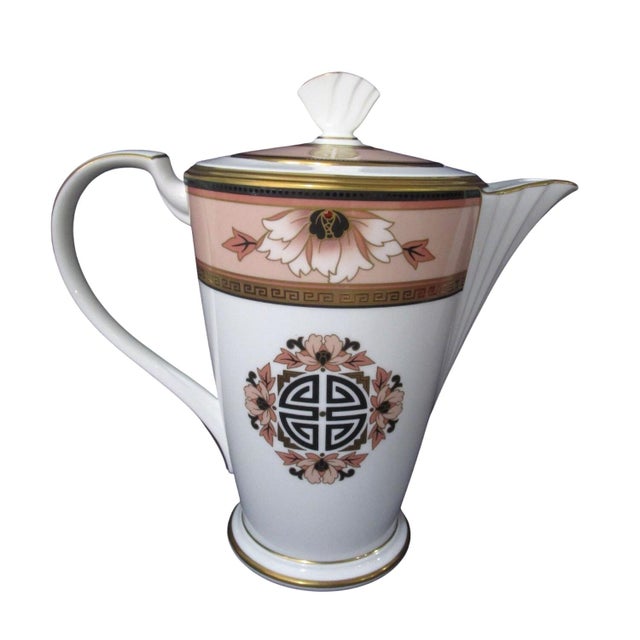 This elegant Noritake coffee pot boasts a refined floral design in soft peach and gold accents. Made from high-quality...