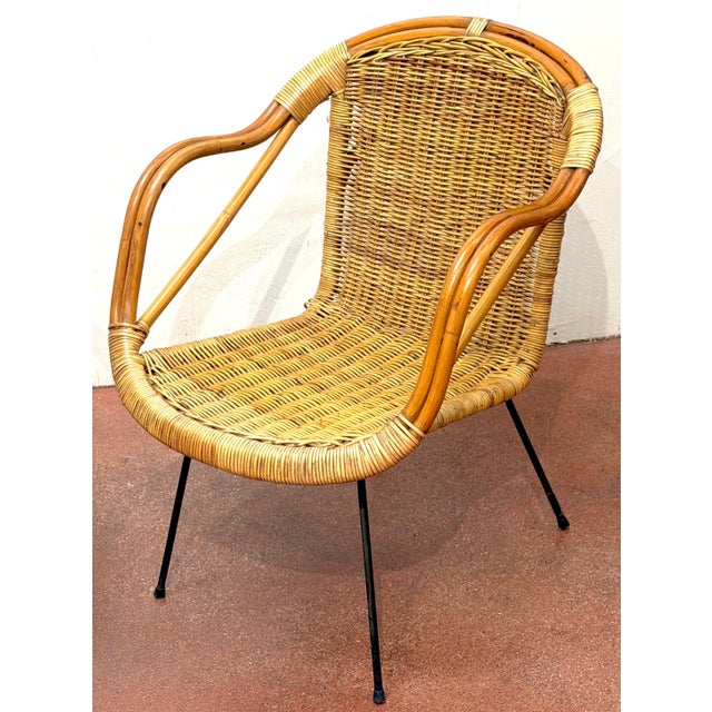 Pair of Italian Bamboo and Rattan Club Chairs Attributed to Franco Albini, Italy, 1950s A sculptural and highly refined...