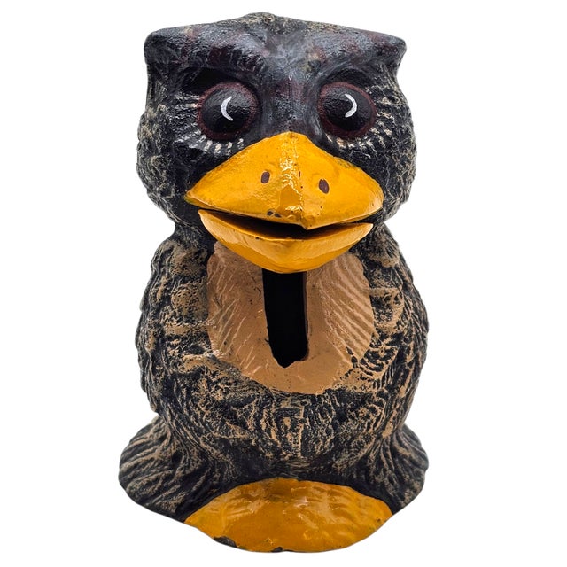 This late 20th-century owl coin bank reflects the period’s interest in whimsical, character-based figural objects produced...