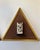Pair of vintage hand-carved bone wall hangings presented in matching triangular gilt-tone frames with brown fabric-covered...