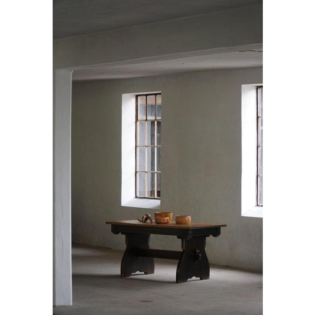 Charming Swedish dining table crafted in solid pine and dating from the first half of the 20th century. The table features...