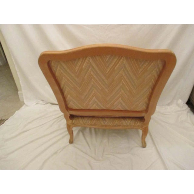 Bergere chair with original chevron chintz upholstery in good condition. Chair has lumbar pillow that is included.