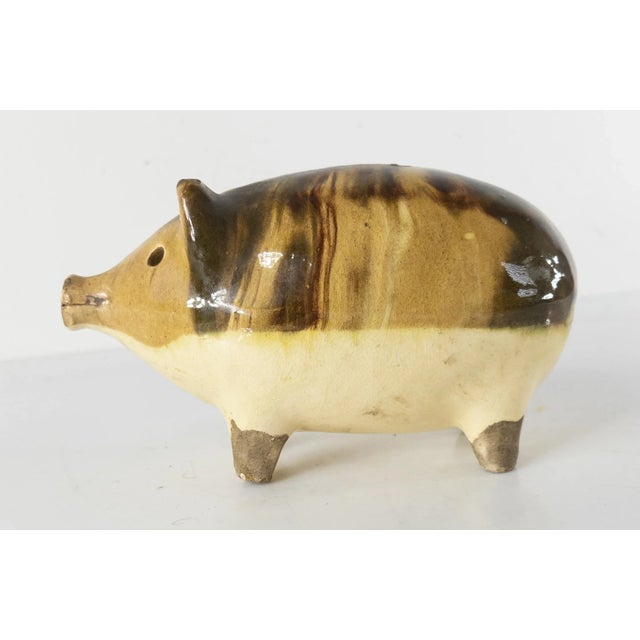 We are selling this charming little marbled pottery piggy bank. This pig shaped bank might be English Staffordshire as the...