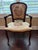 A handsome French Louis XV style fauteuil (open armchair) with a hand-carved walnut-toned hardwood frame and original...