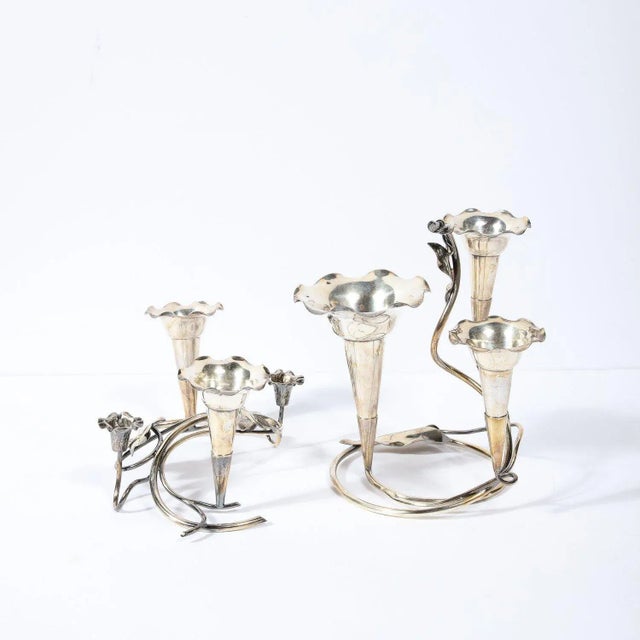 This stunning and sculptural pair of silver-plate Art Nouveau candleholders were realized in the United States circa 1915....