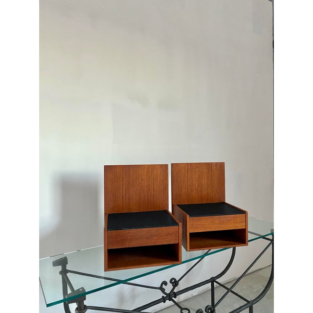 Minimalist floating teak nightstands by Hans Wegner for GETAMA with original textured deep amethyst glass tops. Very Good...