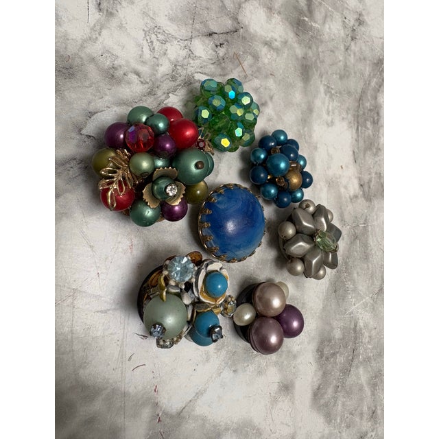 Unique sparkling vintage set of seven upcycled Midcentury jewelry into decorative magnets. Handcrafted and assorted in...