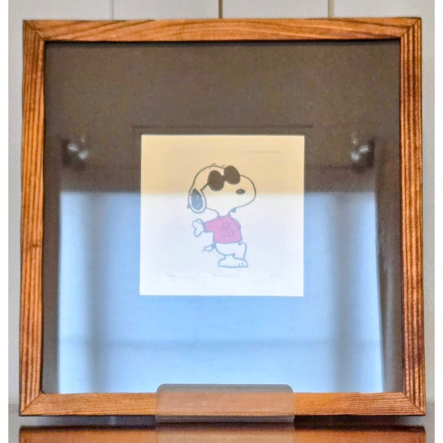 Playful limited edition Snoopy etching, hand-colored and numbered 3/500 in pencil on the lower margin. Snoopy appears in a...