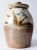 This is a vintage studio pottery jug vase. The hand-crafted pottery features a warm beige and brown speckled glaze with...
