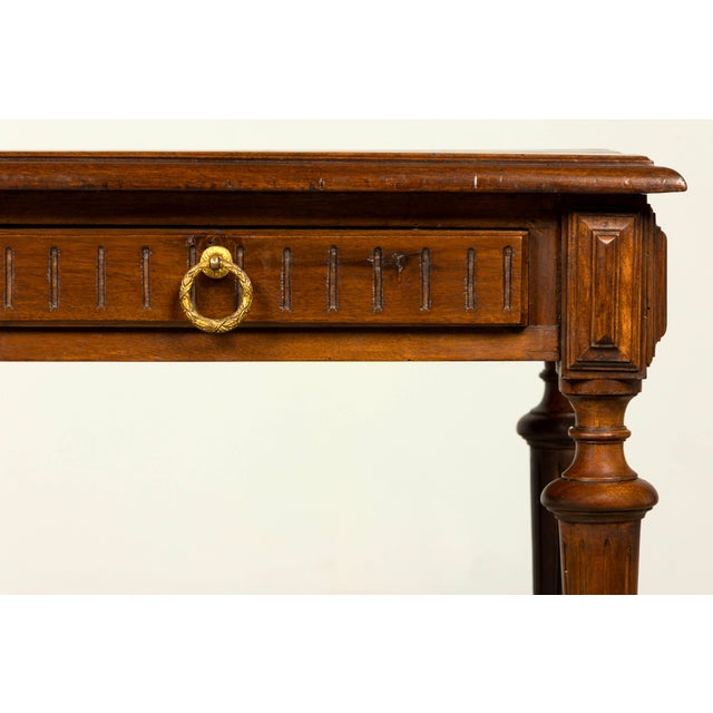 A handsome late 19th-century French Napoleon III walnut writing desk, sourced in Provence, France, circa 1870–1880. The...