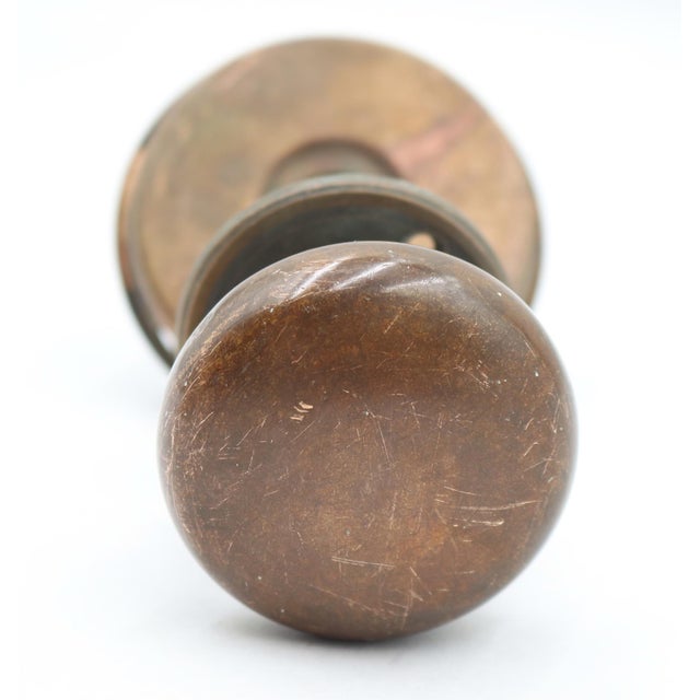 Vintage patina bronze door knob set with a flush mount handle set on one side. The original mounting screws are not...