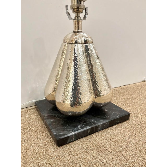 Modern Hammered Nickel Gourd Lamp on black marble base. Showroom floor sample.