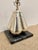 Modern Hammered Nickel Gourd Lamp on black marble base. Showroom floor sample.