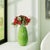 A stunning ode to the grace and elegance of nature's most iconic blooms. This exquisite vase is a botanical masterpiece,...