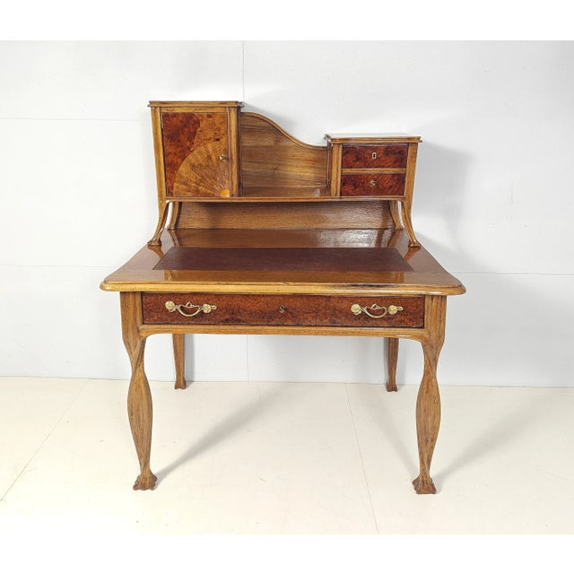 French Art Nouveau desk attr. Louis Majorelle, Nancy around 1910. Solid oak. Doors and drawers veneered with walnut root...